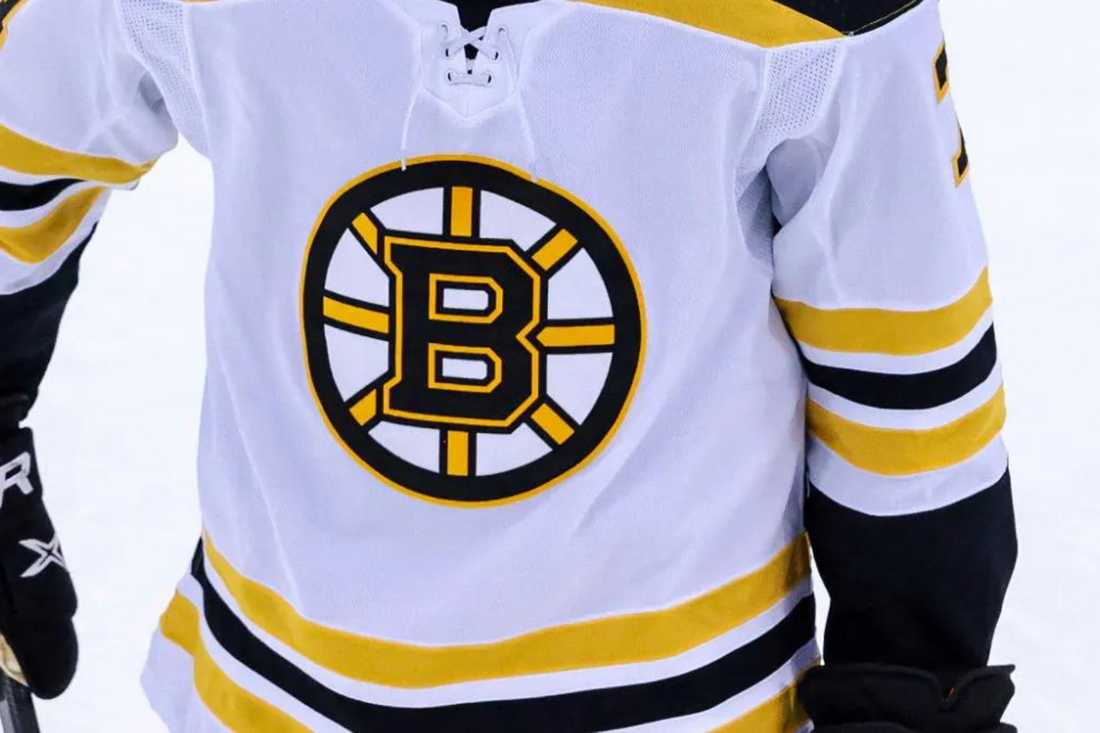 Why does the Bruins logo have 8 spokes?
