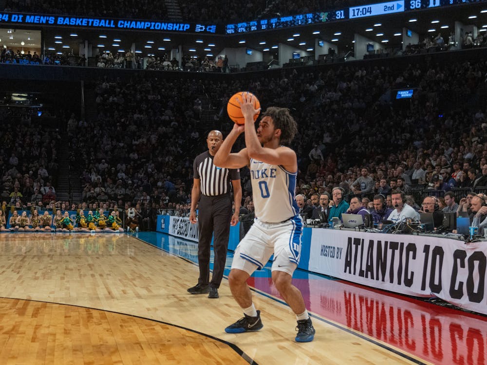 Jared McCain lines up for a 3-point attempt in Duke's NCAA tournament Round of 64 win against Vermont. Photo by Alyssa Ting | The Chronicle